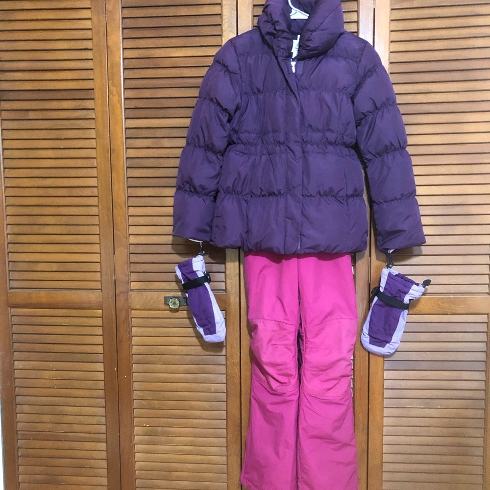Pink kids overalls and purple jacket with matching gloves.